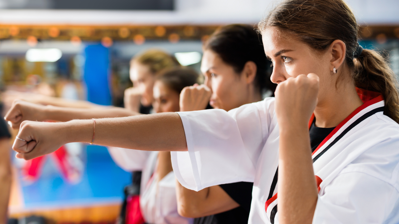 Lady cycling an E-Bike by the sea